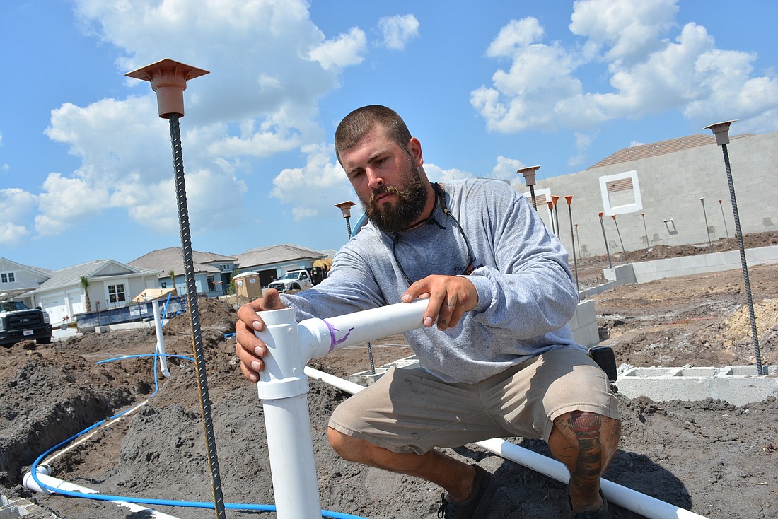 Lakewood Ranch homebuilders said they have not had trouble finding subcontractors, like John Coleman, a plumber with Danny Via Plumbing, who was installing pipes for water and sewer for a new home under construction.
