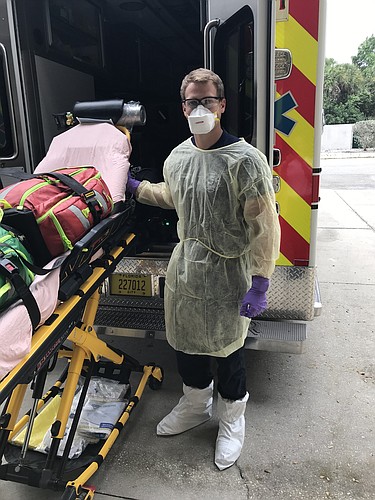 Longboat Key firefighter and paramedic David Oliger is dressed in protective gear to prevent the spread of COVID-19.
