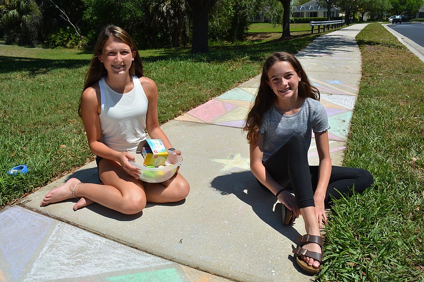 Fourteen-year-old Leah Troiano and her sister, 11-year-old Noelle Troiano, drew patterns, shapes and other art on their driveway and at friends' houses.