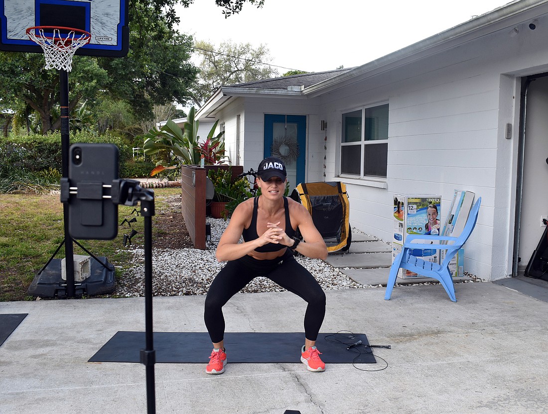 Kelli Jaco, co-owner of Jacoâ€™s Boxing + Fitness Gym livestreams daily workouts from home, so her gym members can continue their fitness regime.