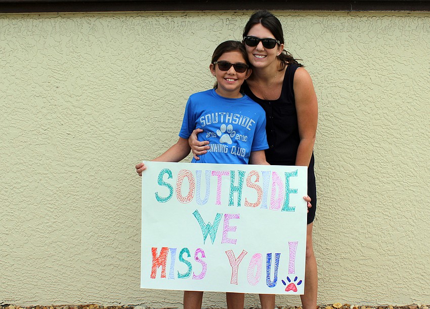 Lucia and Gina Paz made a sign for the parade.