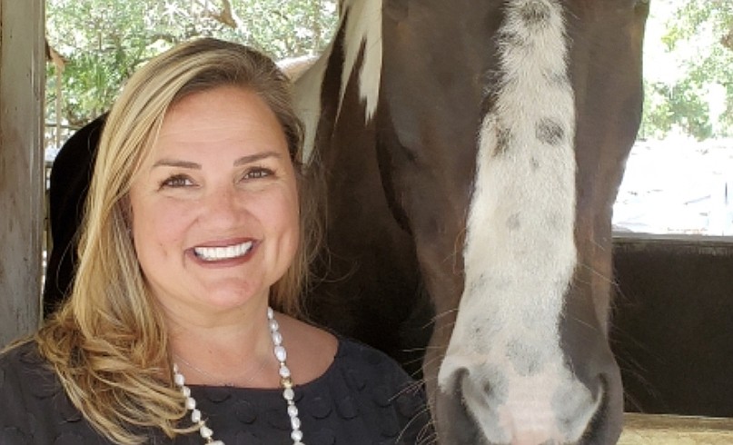 University Place&#39;s Rebecca Blitz, with Gallagher, grew up riding horses and has spent her career working with nonprofits. Courtesy photo.