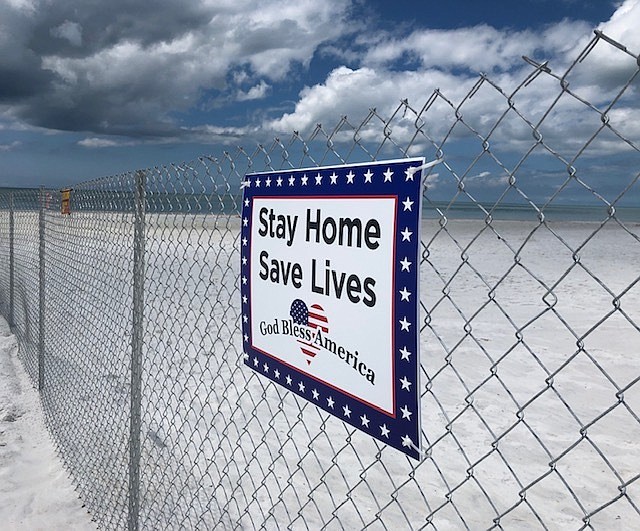Mike Holderness placed fences along his property keep groups from gathering on the beach. Photo courtesy