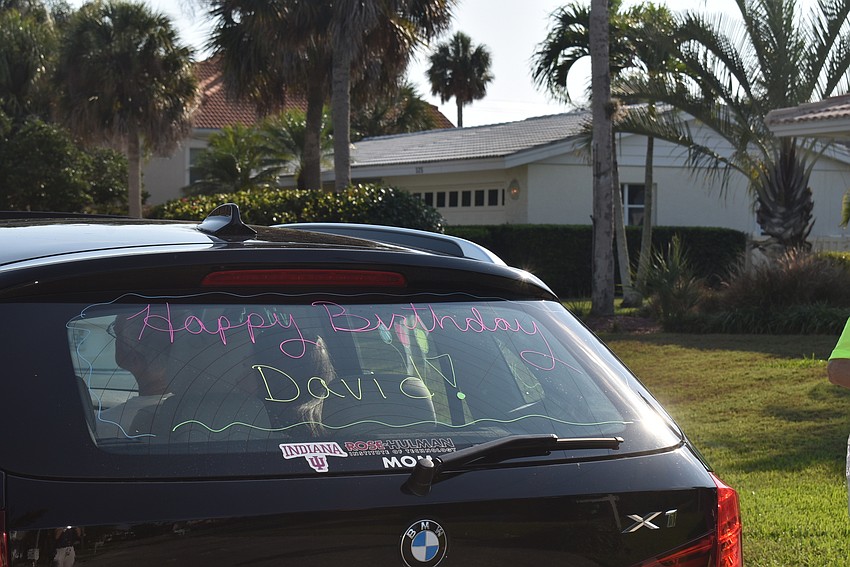 One group of friends painted their car's windows with birthday messages.