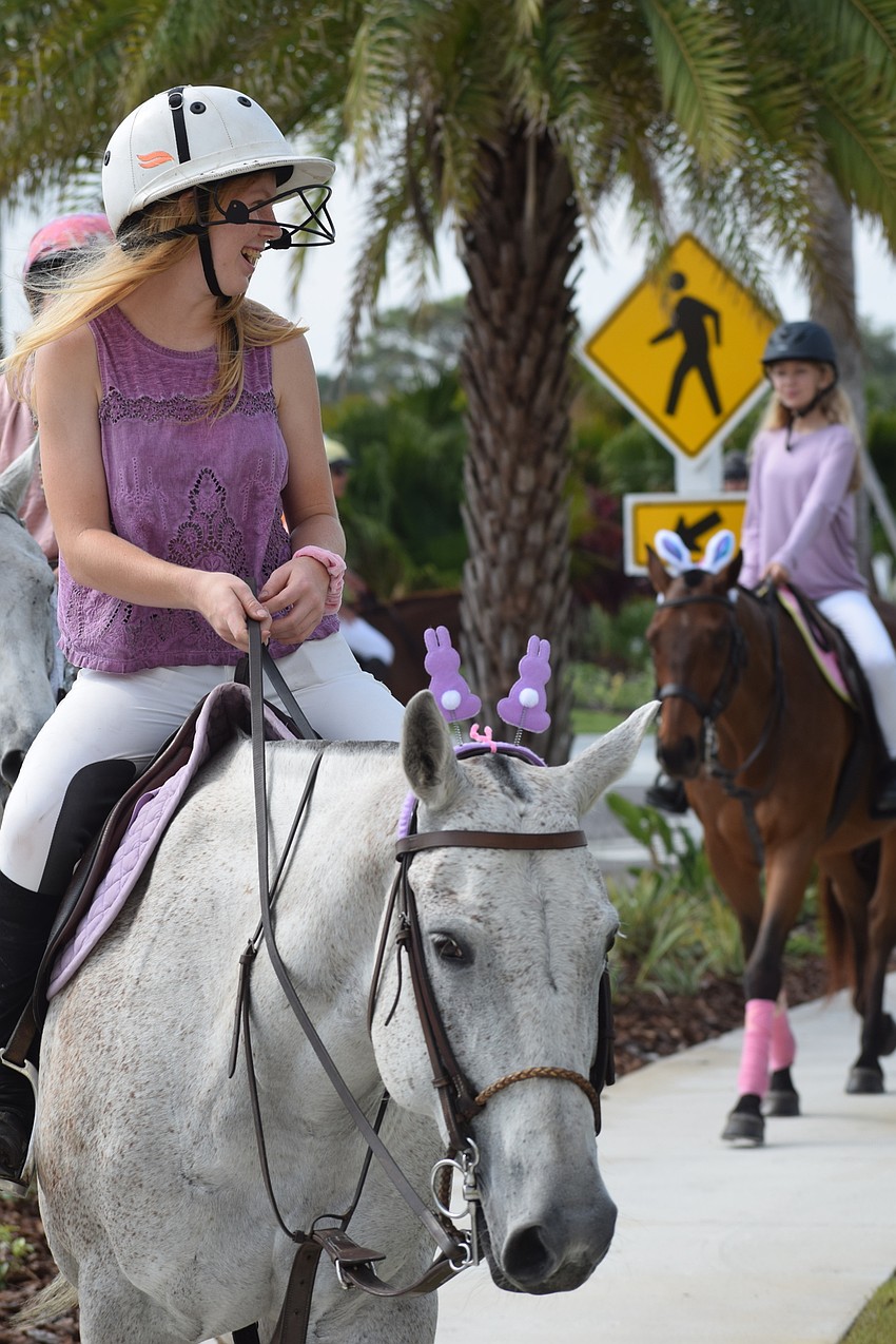The Sarasota Polo Ranch's Kaitlyn Hornung, 16, matched her shirt and her horse's bunny ears.