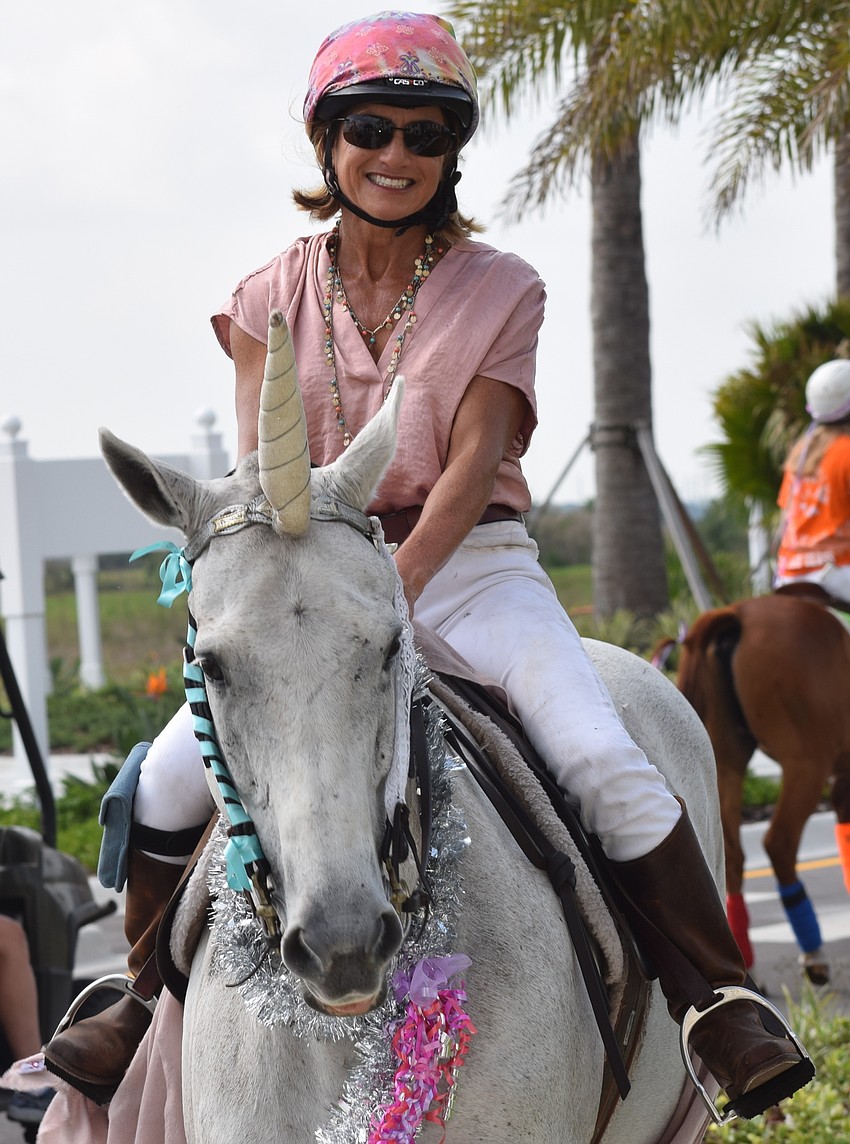 Jaymie Klauber added some whimsey to the event by riding a unicorn.