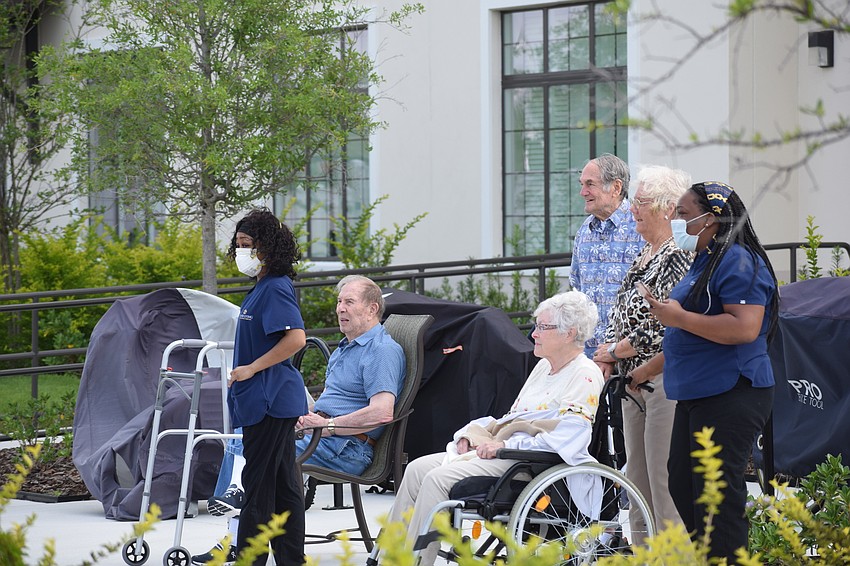 Grand Living residents and employees came out of the building to get a closer look at the parade.