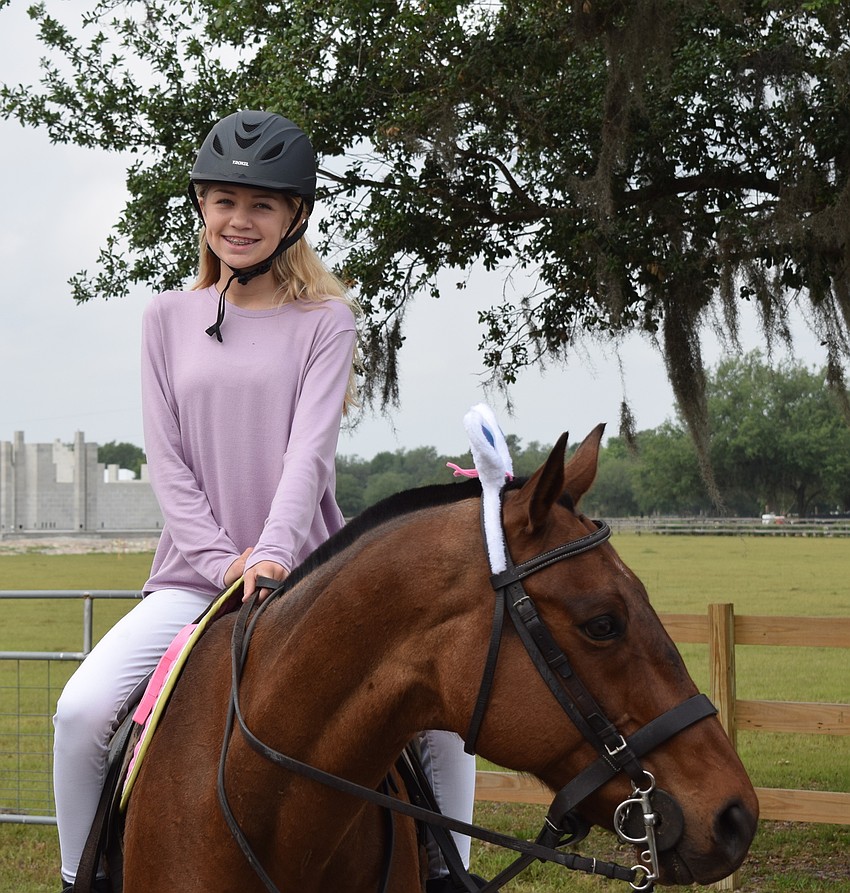 The Sarasota Polo Ranch's Alexa Hornung, 13, gets ready to begin the parade.
