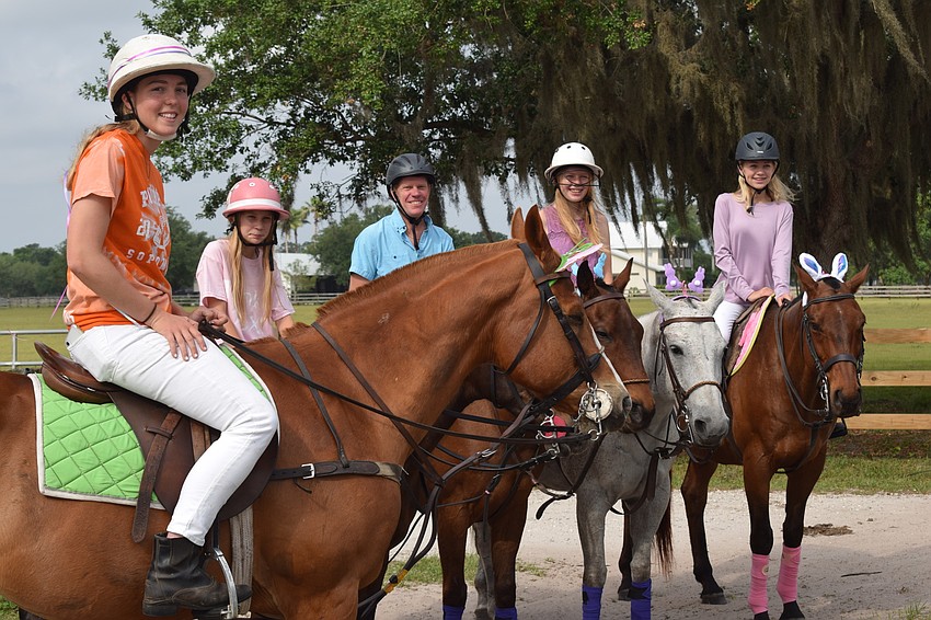 Pippa Campbell, Hanna Hornung, Tim Hornung, Kaitlyn Hornung and Alexa Hornung meet at the Polo Club before beginning their ride to Grand Living.