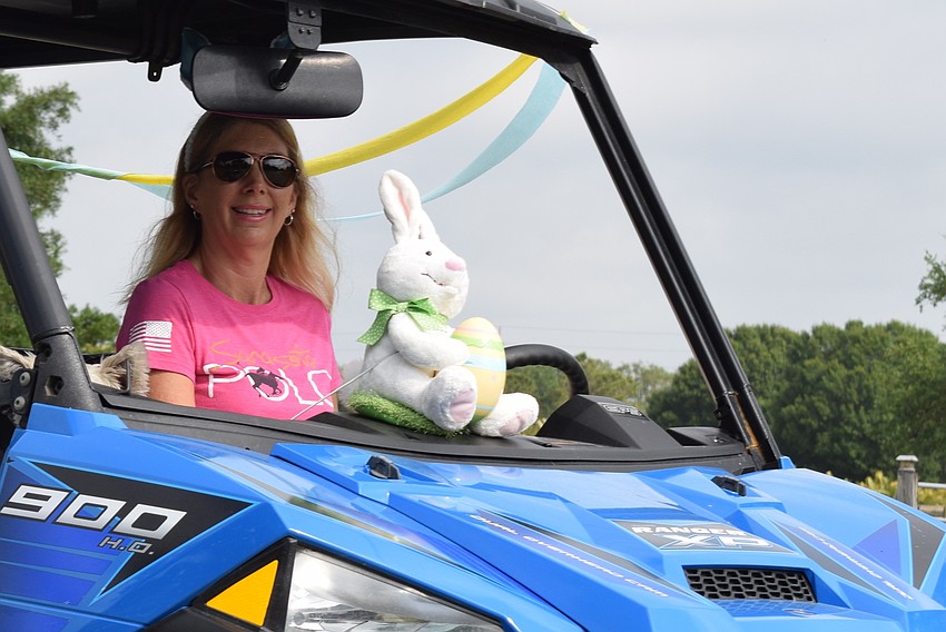 The Sarasota Polo Ranch's Michelle Hornung rode in the parade in a utility vehicle, led by a bunny.