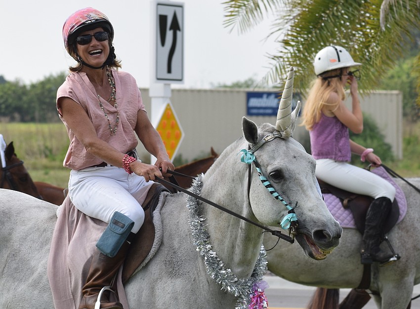 The Sarasota Polo Ranch's Jaymie Klauber found a unicorn to ride during the Easter parade.
