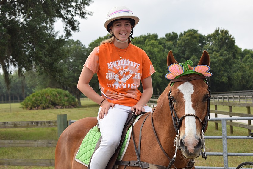 The Sarasota Polo Ranch's Pippa Campbell, 17, begins the ride down to Grand Living at Lakewood Ranch.
