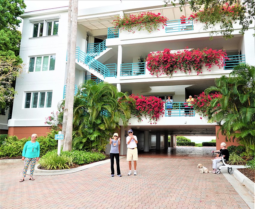 Residents social distance to clap. Photo courtesy of Susan Goodfriend.