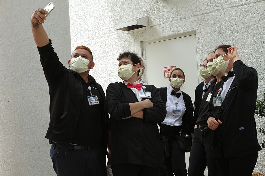 Nurses take selfies before officers begin the salute. Harry Sayer