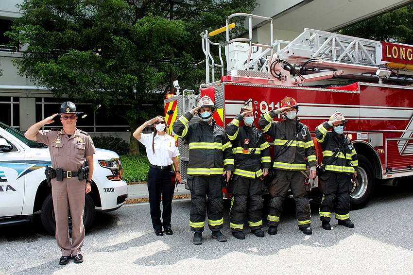 Emergency personnel salutes the  physicians. Brynn Mechem