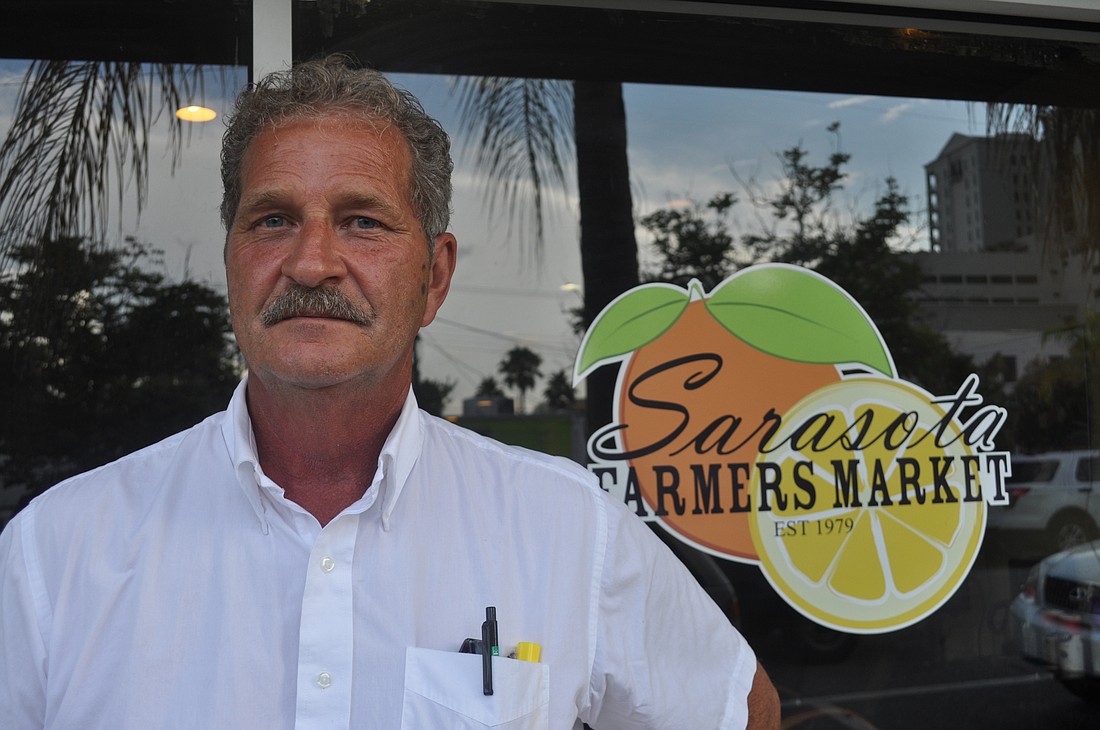 After weeks of tension with the Sarasota Farmers Market board of directors, Phil Pagano said he will resign his position and focus his energy on his popcorn business instead.