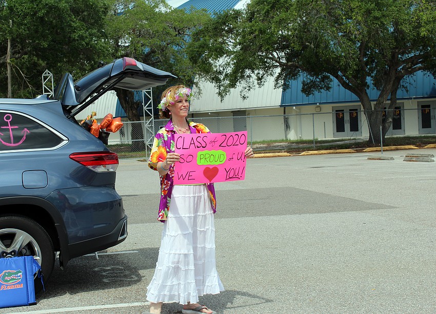 Kimberly Cullen stands by her tropical-themed car.