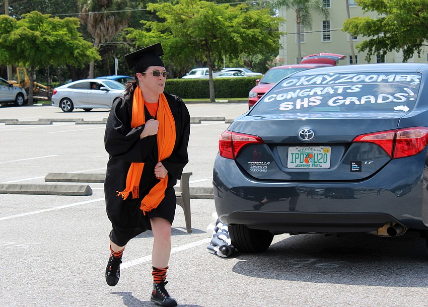 Sarah Sturzu wears graduation garb of her own.