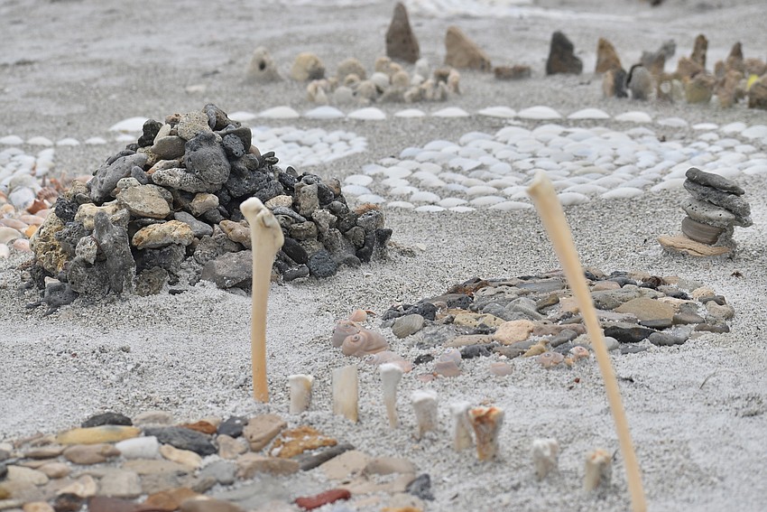 Bird bones pop up from the installation.