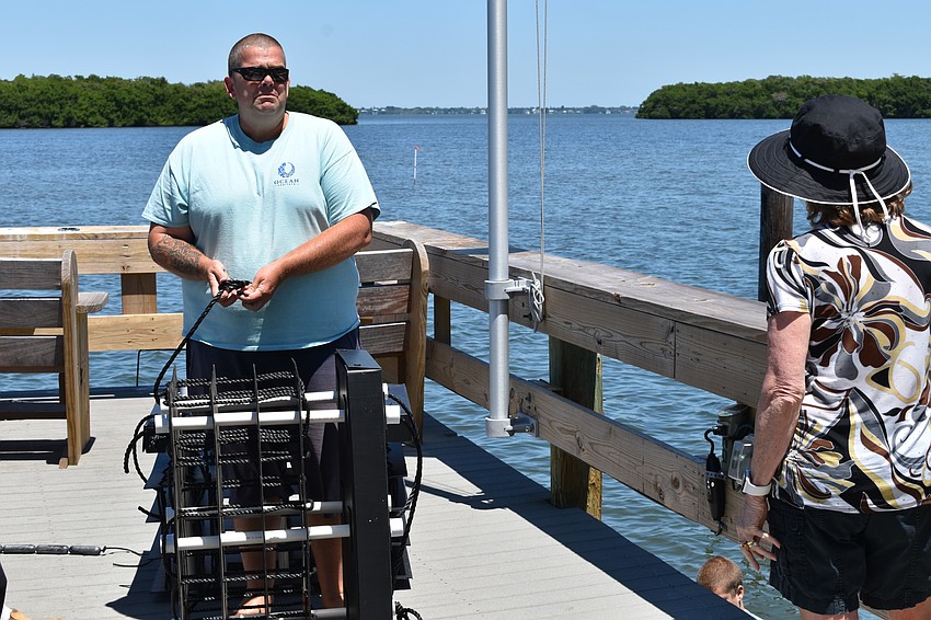 Ocean Habitat Inc. executive director David Wolff prepares a Mini Reef for installation.