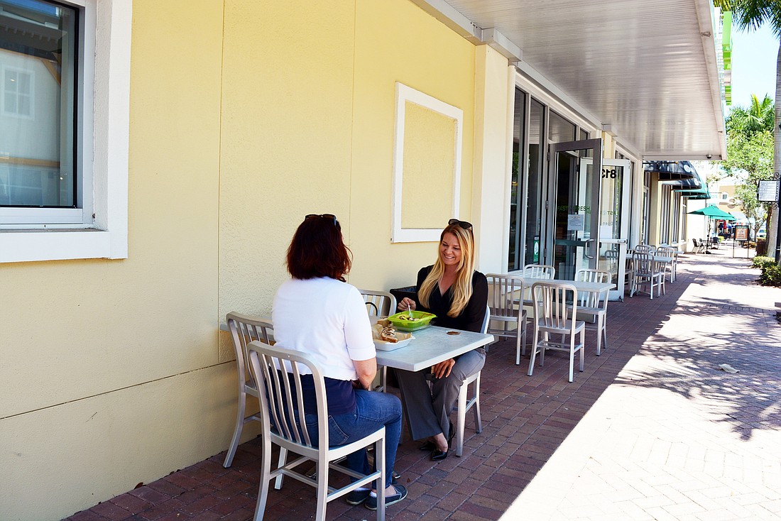 Sarasota&#39;s Cindy Appel and Lakewood Ranch&#39;s Lindsay Roth grab lunch at Fast N Fresh at Main Street at Lakewood Ranch May 4. It was Appel&#39;s first lunch out since the shelter-in-place mandate went into effect.