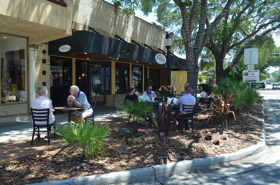 Customers filled the sidewalk cafe outside Patrick&#39;s 1481 on Monday, May 4. Outdoor dining is now permitted in Florida as long as