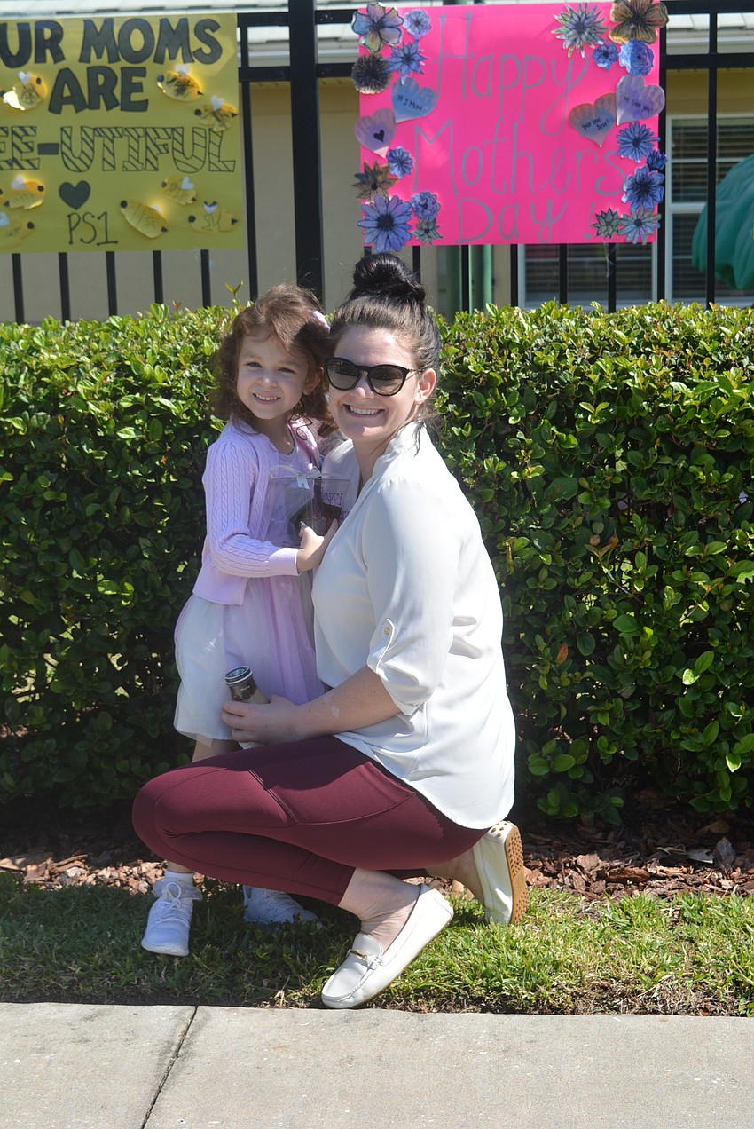 Courtney Pollack accepted a muffin from her daughter, Kennedy Kyllonen, 4, as she dropped her off for the day.