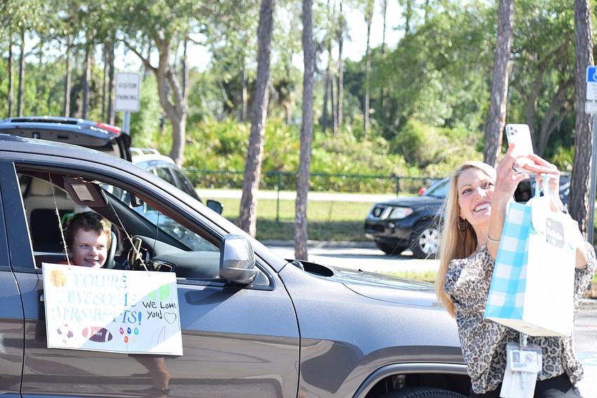 Tristen Gibson, a second grader at Tara Elementary School, smiles for a selfie with his teacher Teresa Betts.
