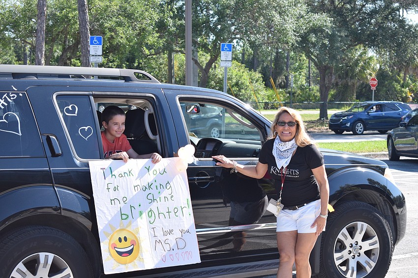 Tobias Guillermoni, a second grader at Tara Elementary School, has his photo taken with his teacher, Rachel Della-Donna.