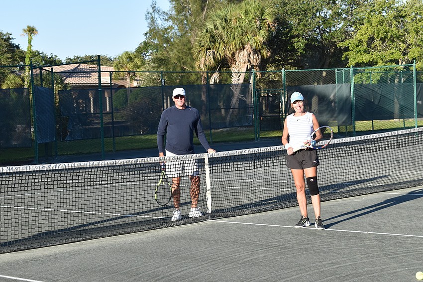 David Glorius and Kate Rhodes were the first two people to play when the Longboat Key Tennis Center reopened at 7:30 a.m. Friday.