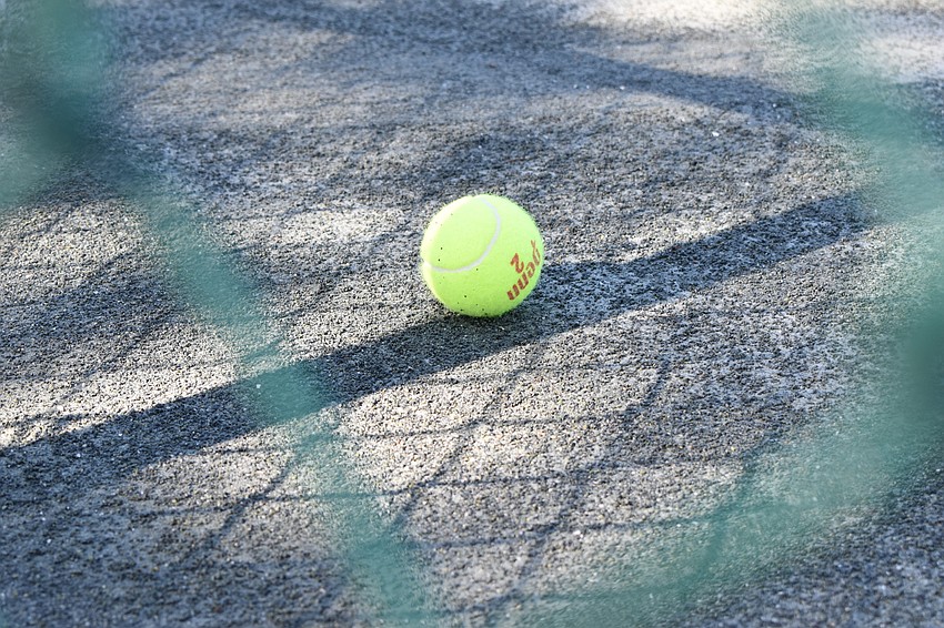 Each court at the Longboat Key Tennis Center is required to use two new cans of balls. Each player is supposed to use their own call of balls with different numbers, keeping at least 6 feet apart.