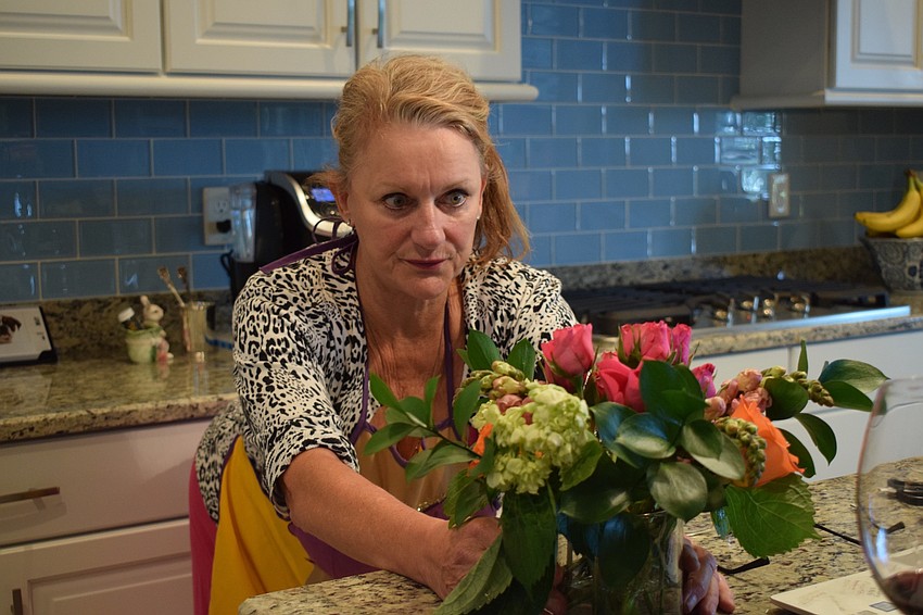 Jacquie McLaurin, a fifth grade teacher at Robert E. Willis Elementary, rotates her arrangement to see if it's symmetrical.