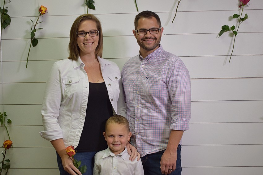 Parrish's Heather and Anthony Coy take a  Mother's Day portrait with their 3-year-old son Lincoln. Heather Coy says they came to the church to see some of their church family and support the church.