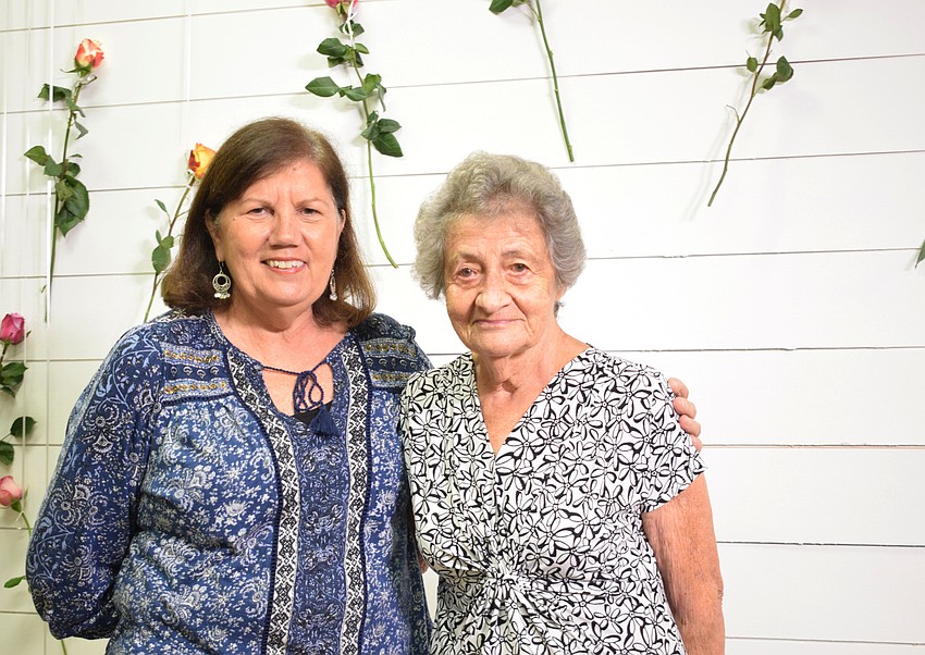 Lou Burns drives from northwest Bradenton to take a photo with her mother Sue Swartz at Oasis Church.