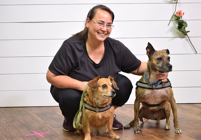 Parrish's Alyson Moyers gets a photo with her dogs Gracy and Lilly. Moyers came by the church to get prayers before her breast cancer surgery May 12.