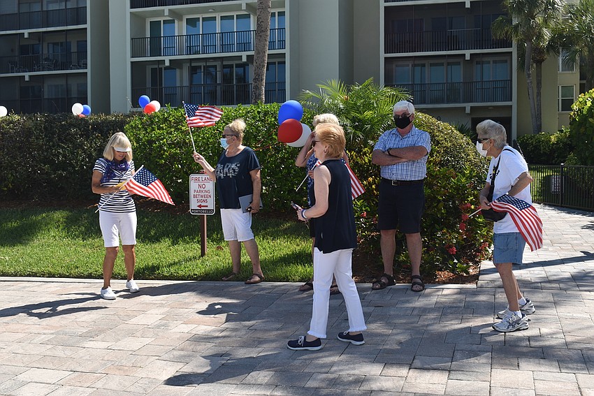 A group of residents head to the parking lot to sing to Larry Rivkin.