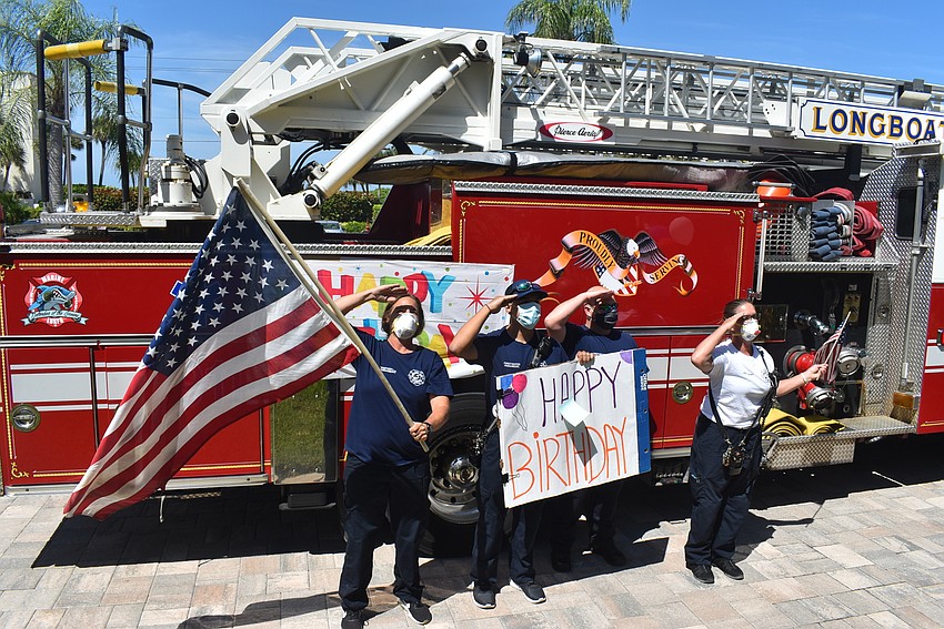 Dawn Dunkum, Josh Falcone, Rich Room and Lt. Kerri Brooks salute Larry Rivkin.