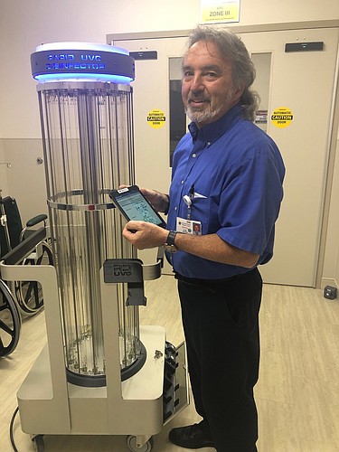 Donny Long, Lakewood Ranch Medical Center&#39;s director of environmental services, works with the RD UVC by Steriliz system.