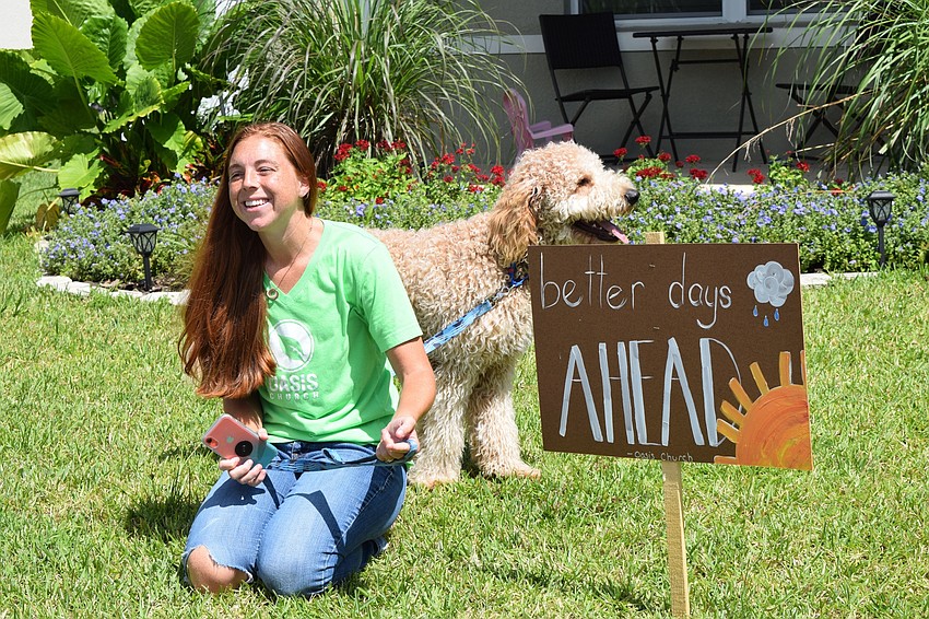 Del Tierra's Bethany Laney is pleased with the sign Oasis Church members made for her family's front lawn. 