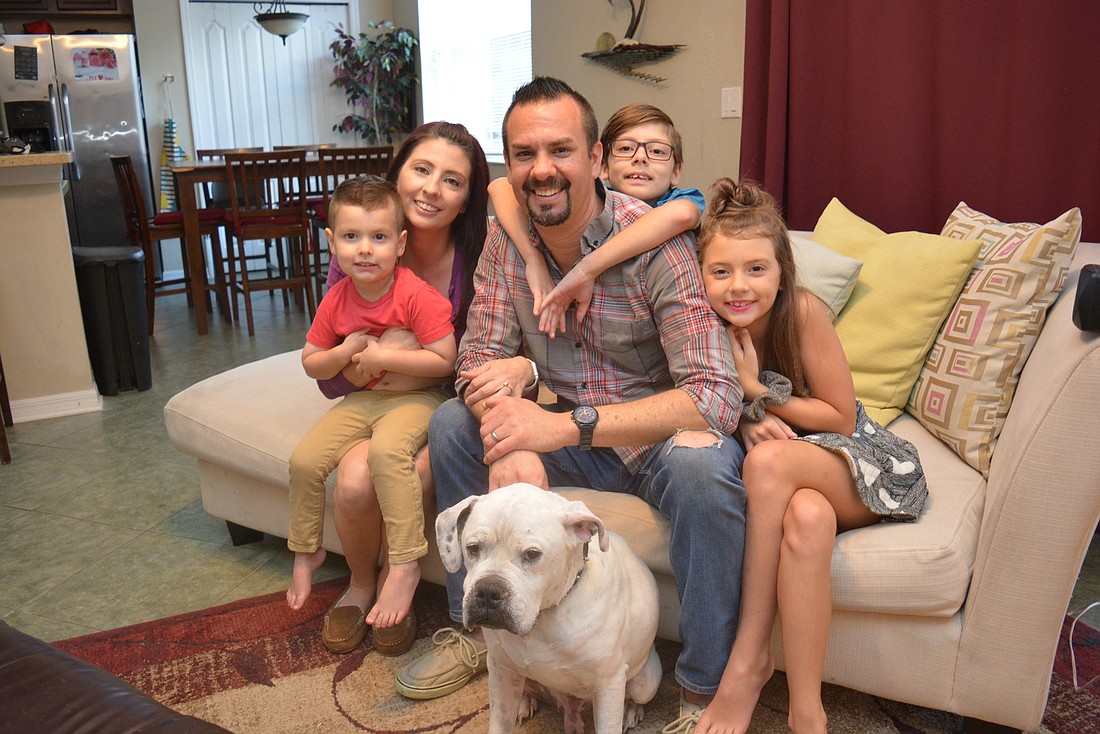 Andrew Arbanas, center, is happy to be able to interact with his family after a month of intensive care for COVID-19 patients. Jaxson, Tiffany, Jude and Aryella are thrilled to be able to hug him.