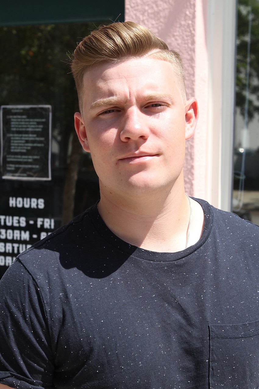 Cameron Lizotte has been waiting patiently for APX Barber Co. to reopen so he could get a cut.