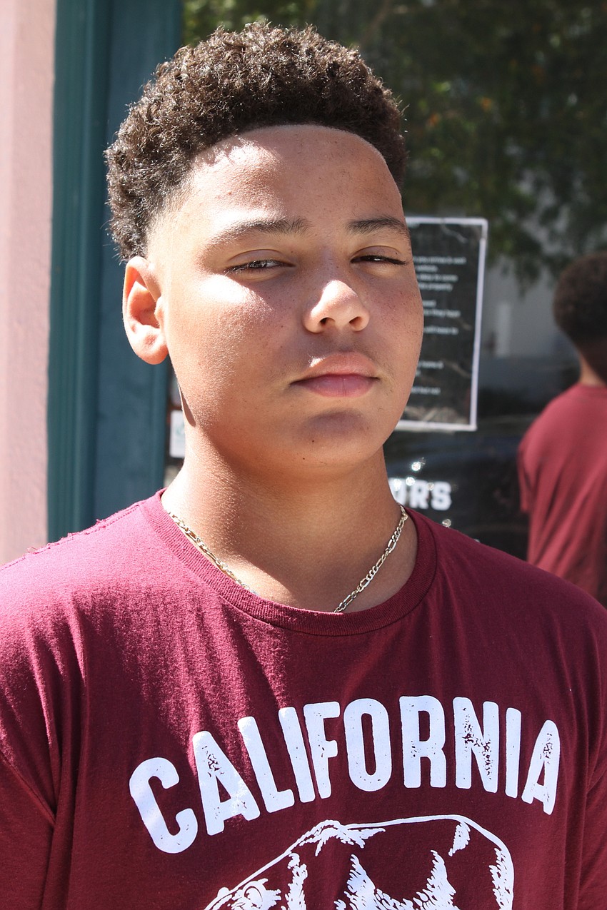13-year-old Shamar Littles typically shampoos, conditions and twists up his hair but wanted a trim at APX Barber Co.