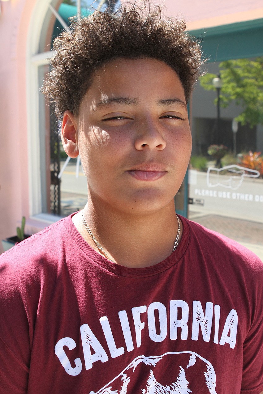 13-year-old Shamar Littles typically shampoos, conditions and twists up his hair but wanted a trim at APX Barber Co.