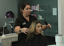 Sirius Day Spa manager Jenn Devine took her time touching up Lindsey Golonka &#39;s hair.