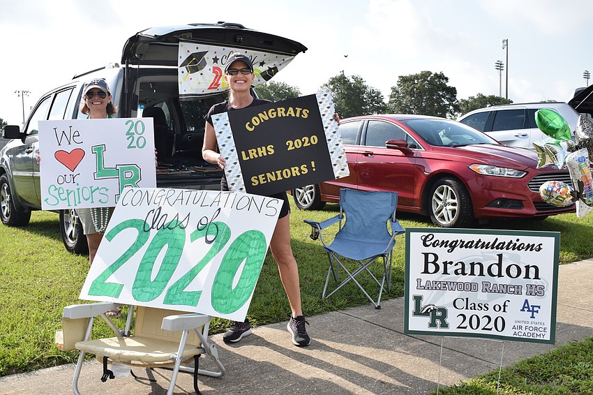 Stacey Gadeken and Alison Denboggende love being able to do something to honor their seniors. Gadaken told her son Brandon she was going to work but actually went to the parade to surprise him.