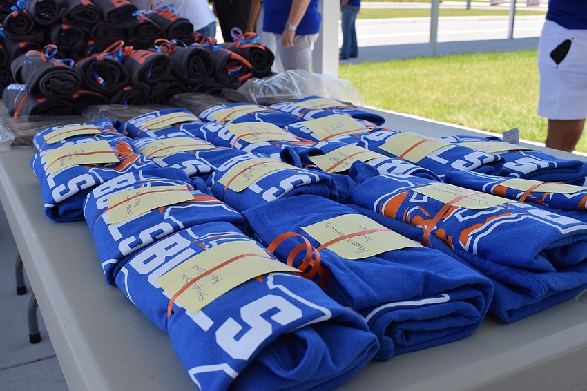The Mona Jain Middle School Parent-Teacher Organization passed out T-shirts to every eighth grader.
