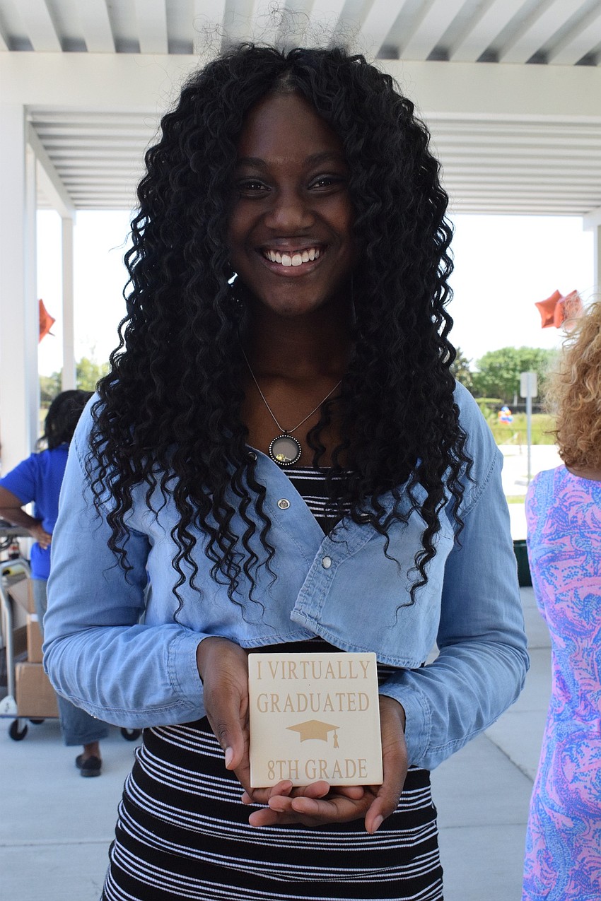 Laila Ward, an eighth grader at Mona Jain, made tiles for every eighth grader.