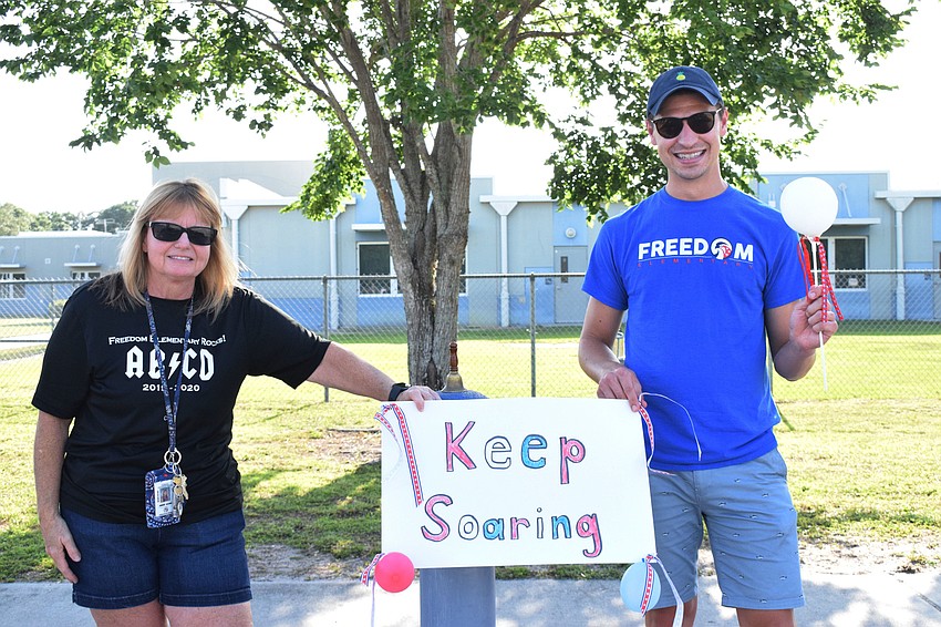 Ariane Wilson and Cory Bernaert, kindergarten teachers at Freedom Elementary, encourage fifth graders to keep soaring as they move onto middle school.