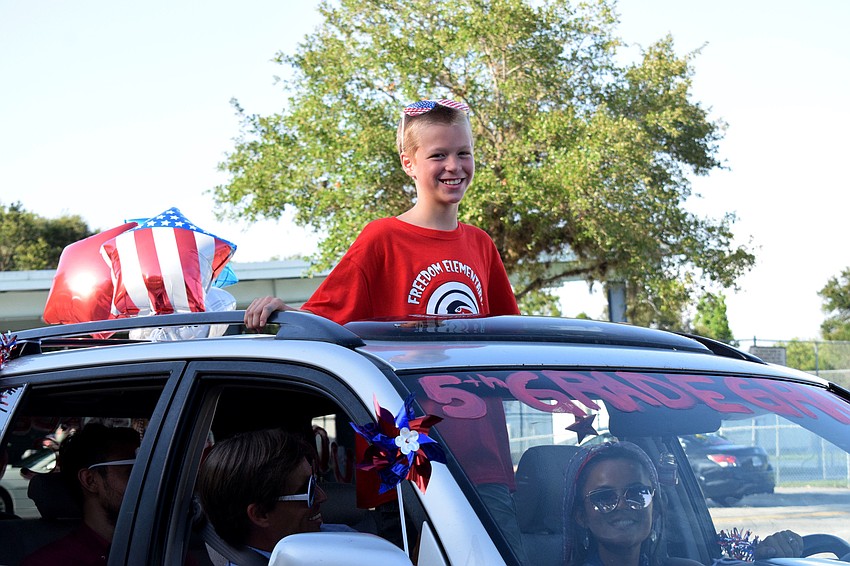 Jacob Crawford, a fifth grader at Freedom Elementary, enjoys seeing his teachers and celebrating his graduation.