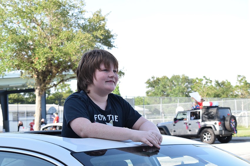 Ben McRee, a fifth grader at Freedom Elementary, is amazed by the teachers' and staff members' signs and decorations. 